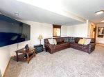 Basement family room with 75 inch TV 